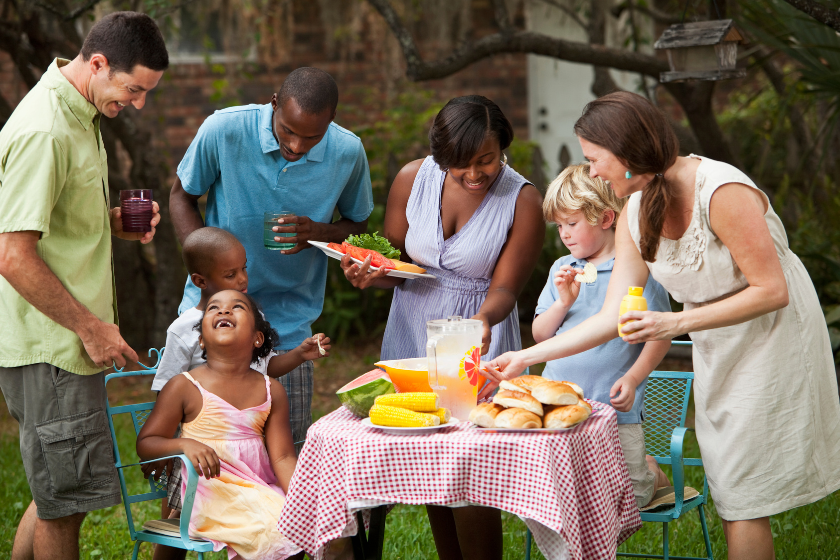 Two families at backyard cookout
